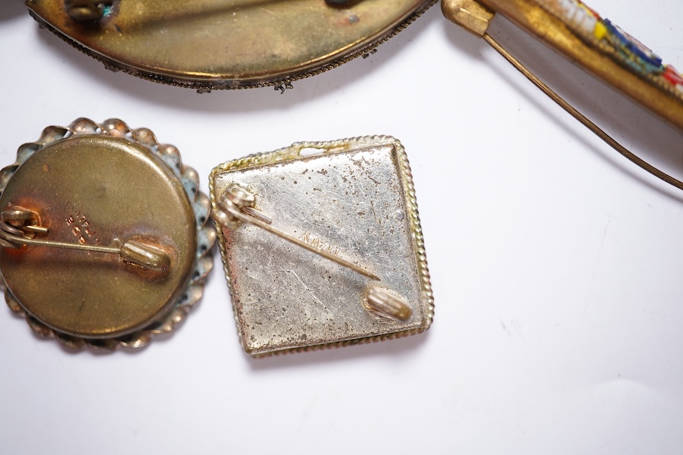 A collection of twenty-eight micro-mosaic brooches, including ten banjo and guitars shaped brooches, six similar large oval brooches, nine small brooches and three long brooches. (28) Condition - good